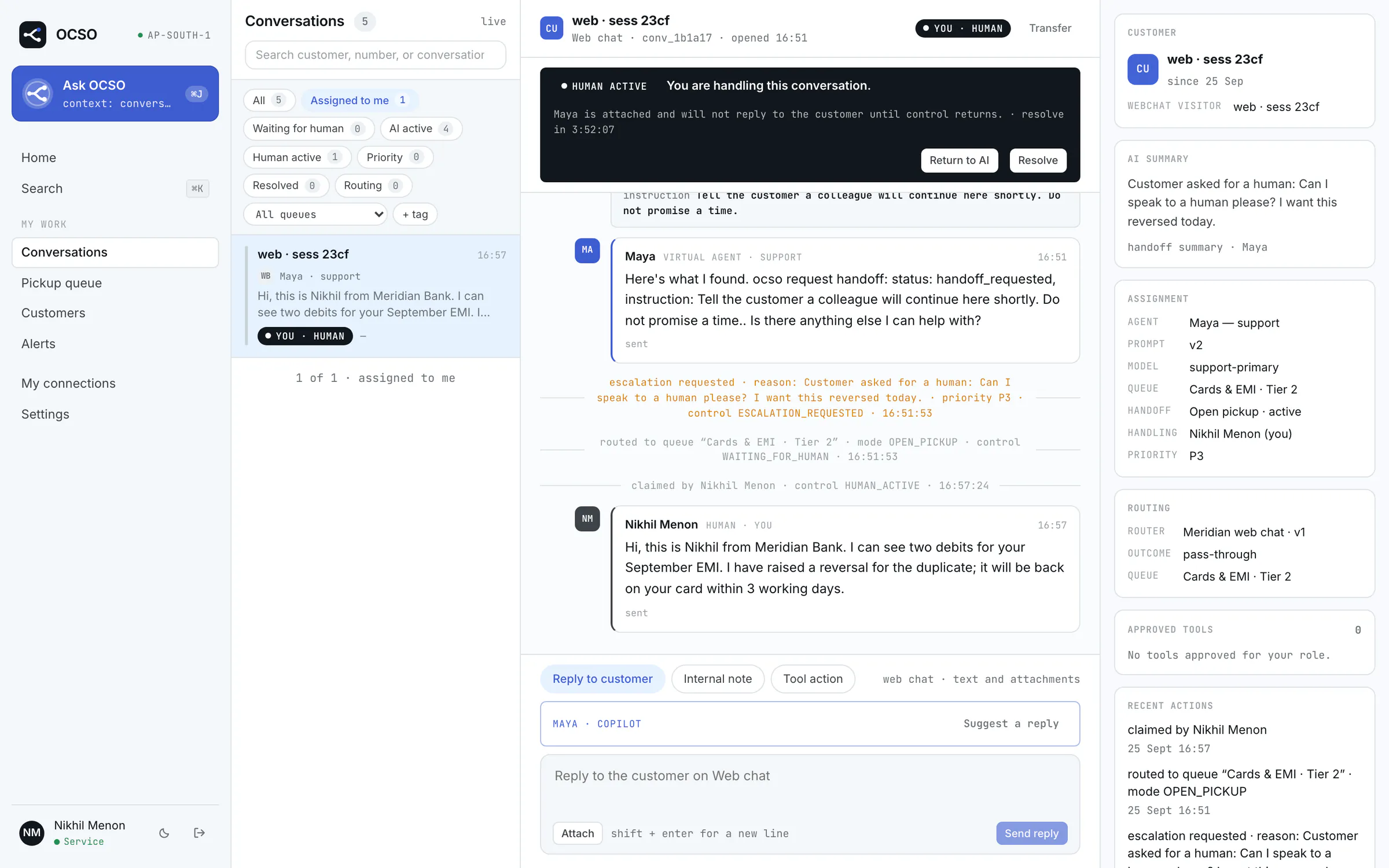The conversation workspace for Nikhil Menon, a Service member: a web chat that the AI agent Maya escalated to the Cards & EMI Tier 2 queue, where Nikhil claimed it and replied about a duplicate EMI debit. Side panels show the AI summary, the assignment and the routing.